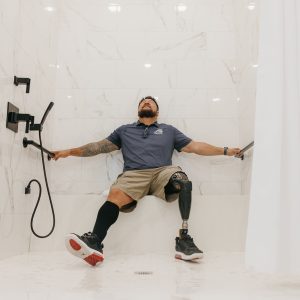 SGT Tuufuli_Wounded Veteran Enjoying His New Accesible Shower